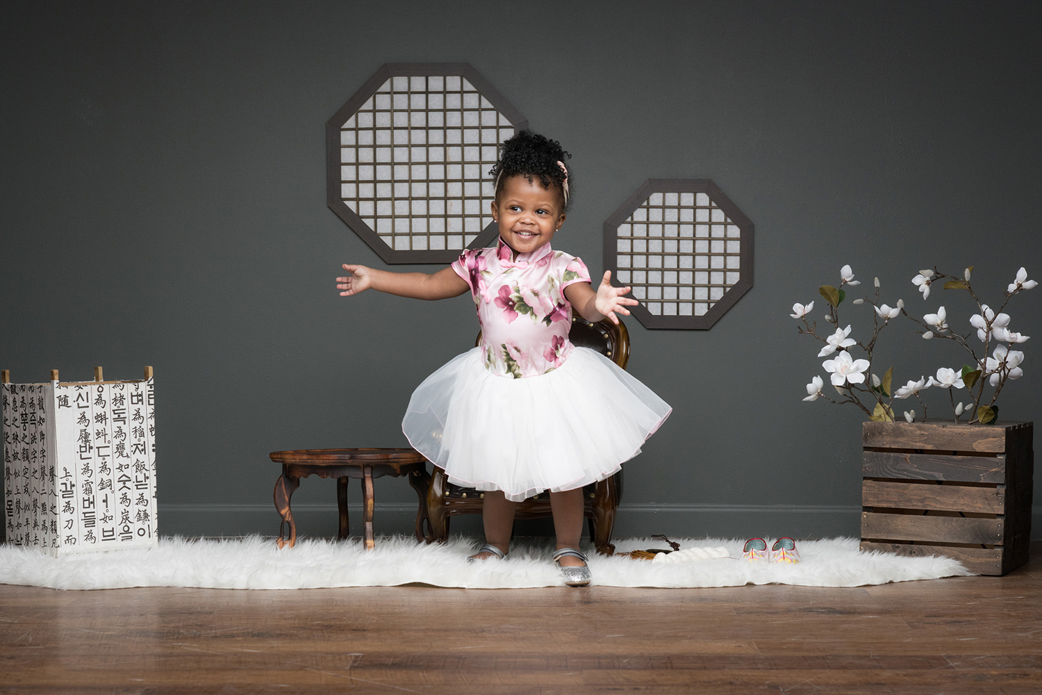 Sophia dances and smiles during a family photoshoot in Chicago.